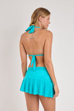 Laad de afbeelding in de Gallery-viewer, Model Back: Rio De Sol Beach Skirt Amb-Nannai Mini Skirt